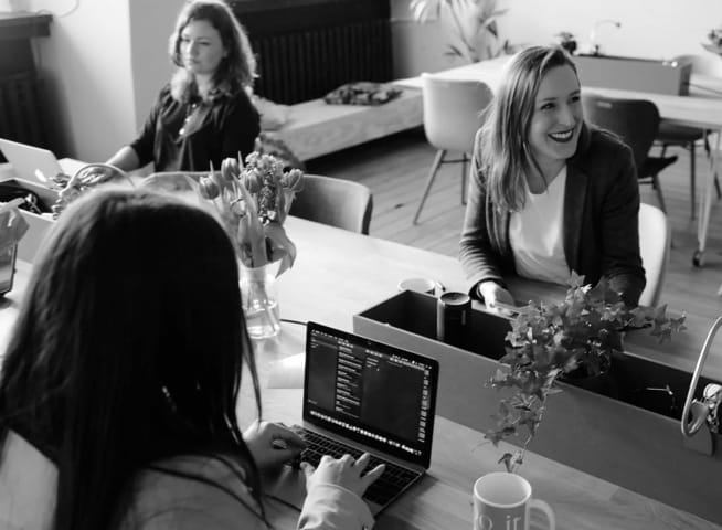 picture of people sitting at desk in the office